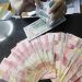 Rupiah Hari Ini Turun terhadap Dolar AS akibat Tarif Impor Trump